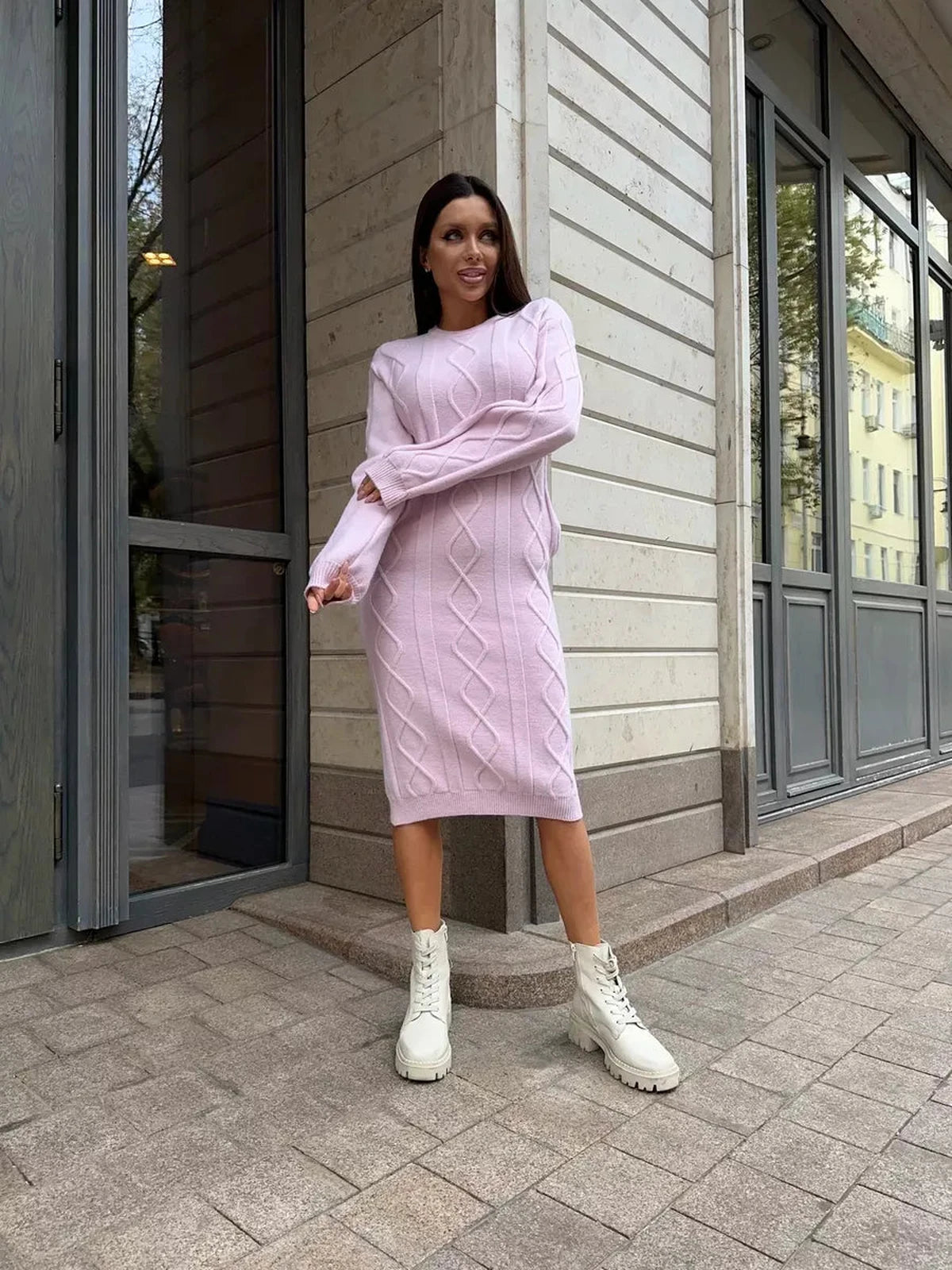 Luna Midi Dress in soft pink on model, showcasing stylish textured knit and versatile design by Lauven.
