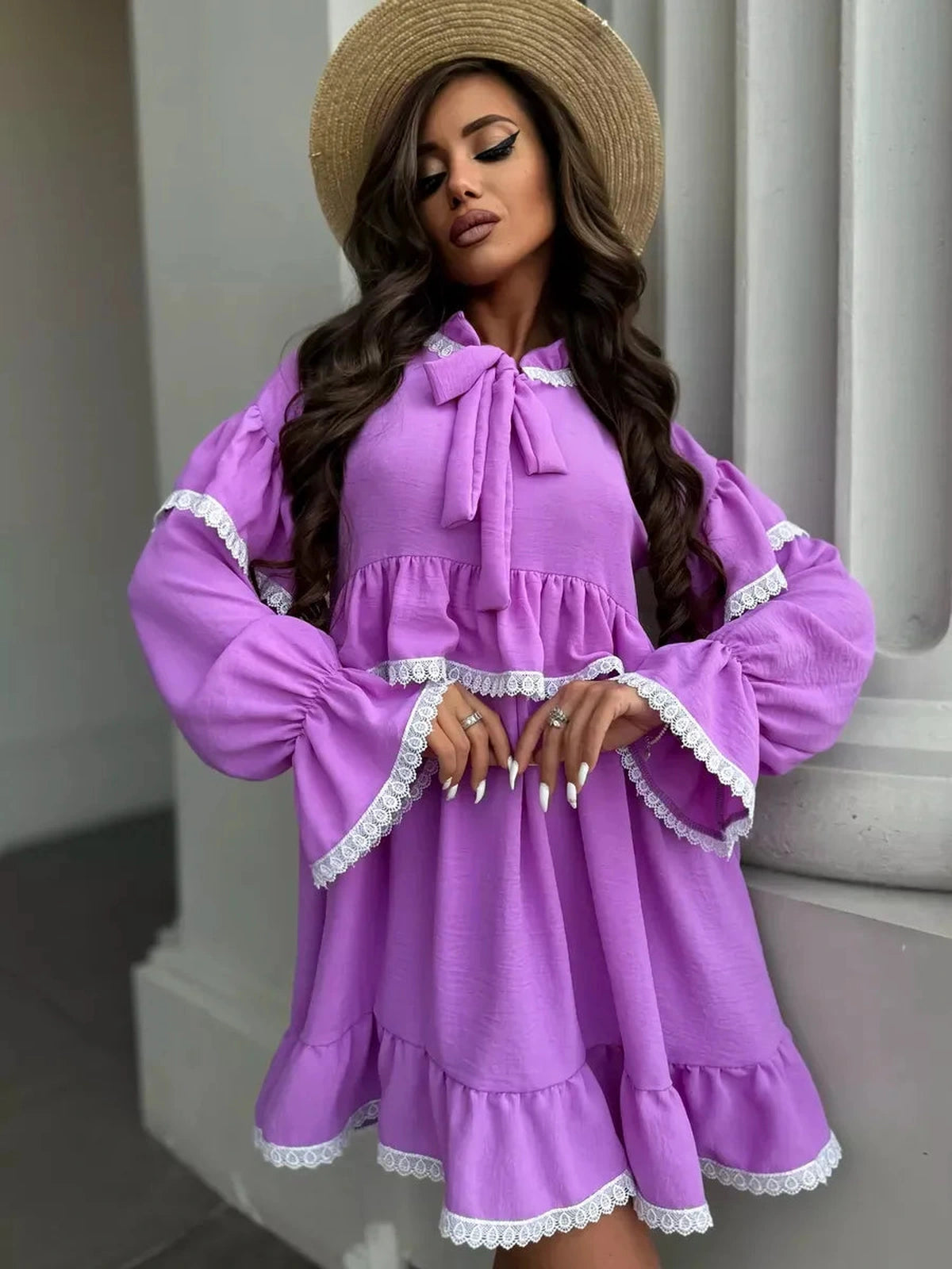 Violetta Mini Dress by Lauven featuring a lilac color, delicate lace, and flowing ruffles for an elegant look.