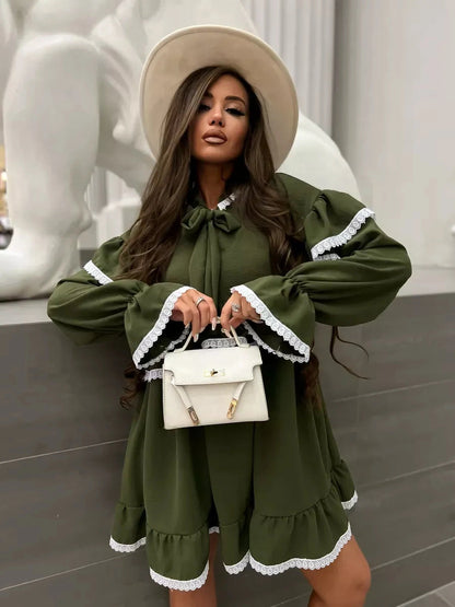 Olivea Mini Dress by Lauven featuring romantic ruffles and lace trim in khaki color, styled with a chic handbag.