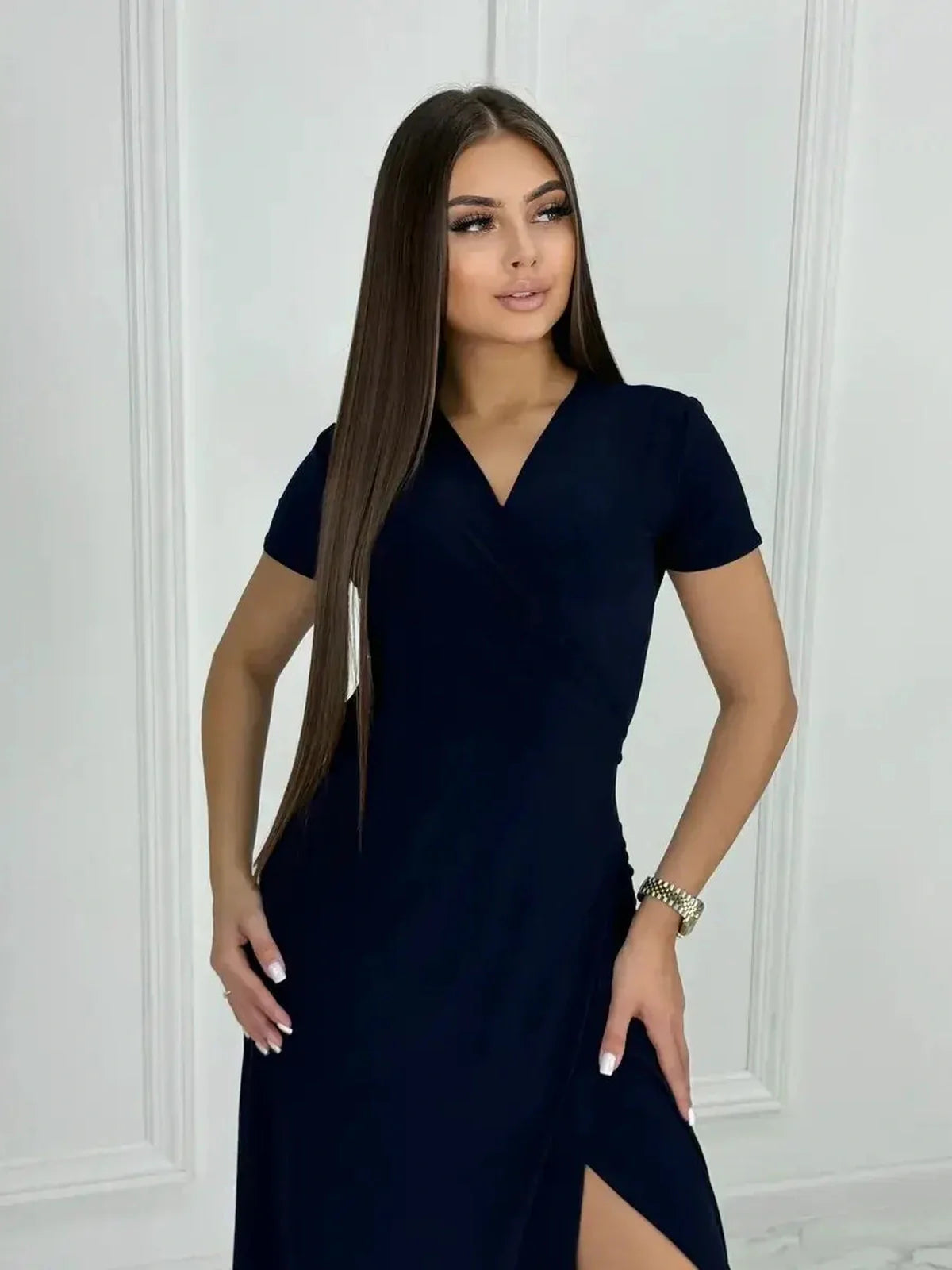 Eclipse Maxi Dress in navy with sleek wrap bodice and side slit, showcasing modern femininity and elegance.