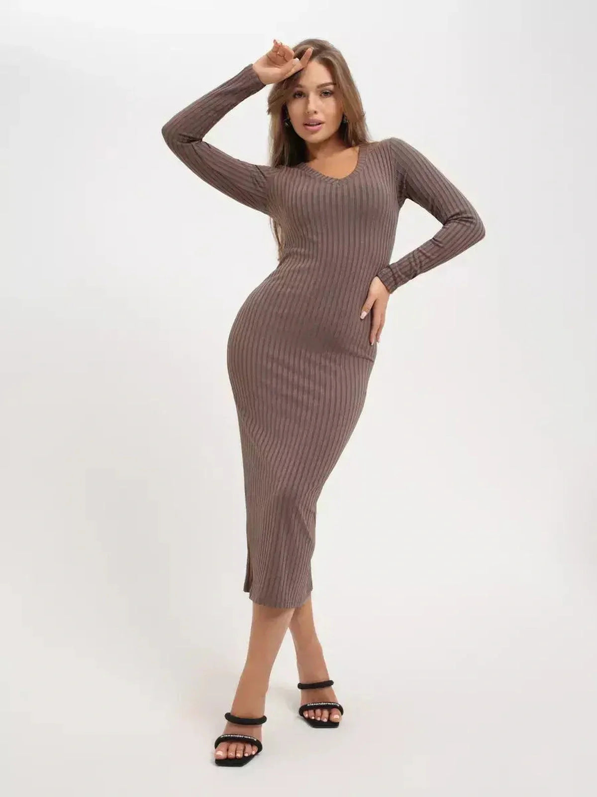 Sleek ribbed midi dress on model, showcasing a sculpted fit and elegant silhouette for versatile styling.