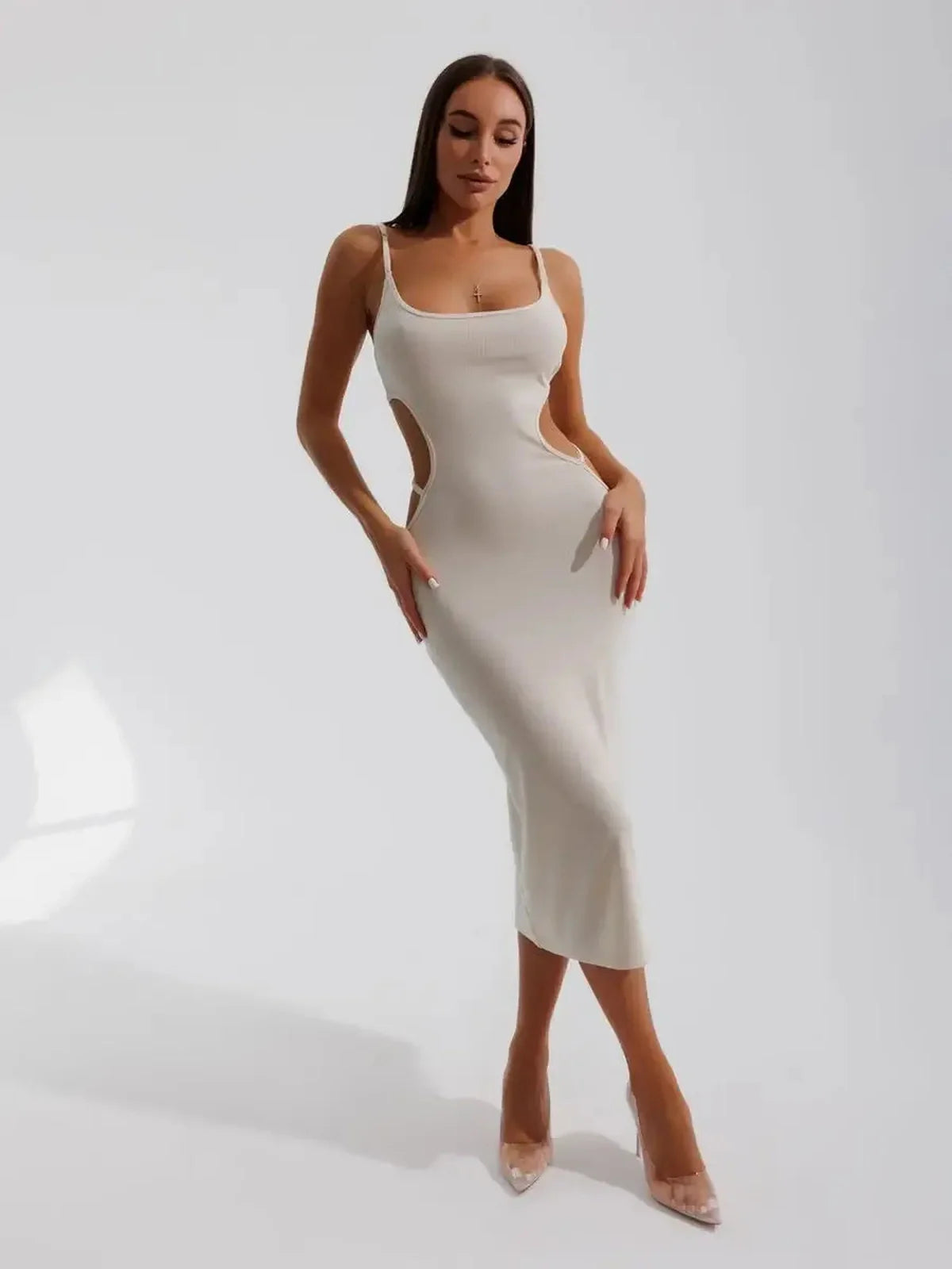 Midi Dress Seraphine in beige, featuring sculptural side cutouts and a bodycon fit for a stylish silhouette.