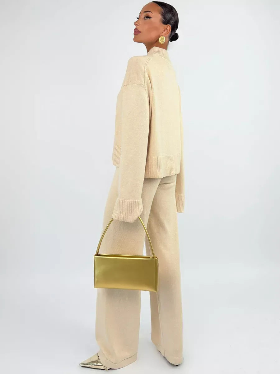 Eterna Sweater by Lauven, oversized light beige knitwear styled with chic accessories.