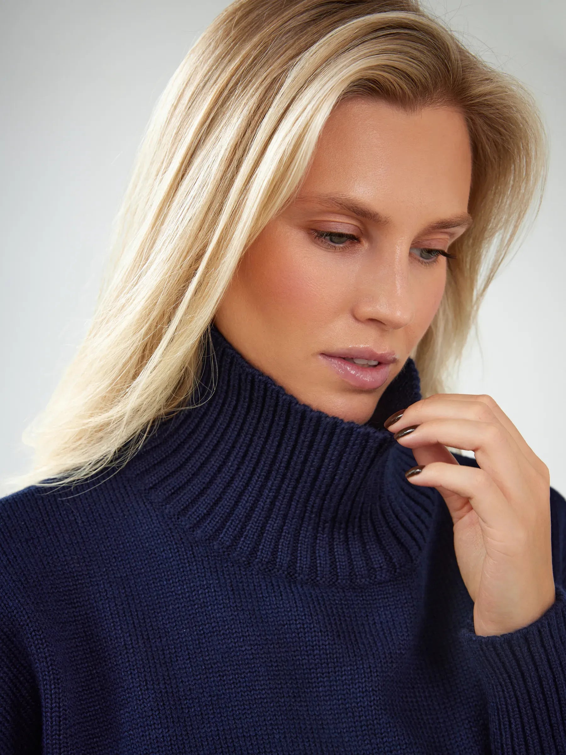Celeste Sweater by Lauven, oversized women's wool knit turtleneck in dark navy, showcasing cozy elegance and style.