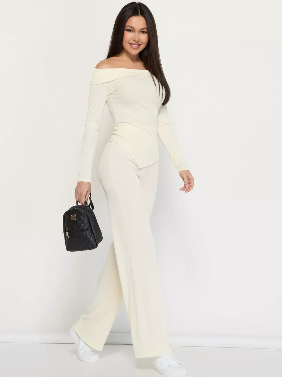 Ivory Two-Piece Set by Lauven, showcasing a model in an off-shoulder ribbed women’s suit, exuding elegance and style.