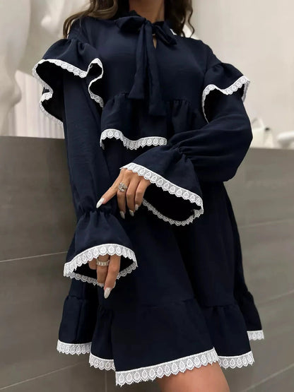 Celeste Mini Dress by Lauven featuring graceful ruffles and lace accents in dark navy.