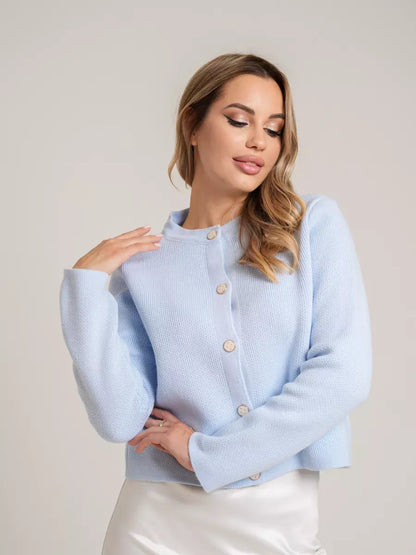 Celeste Cardigan by Lauven in light blue, showcasing a short loose fit, decorative buttons and elegant style.