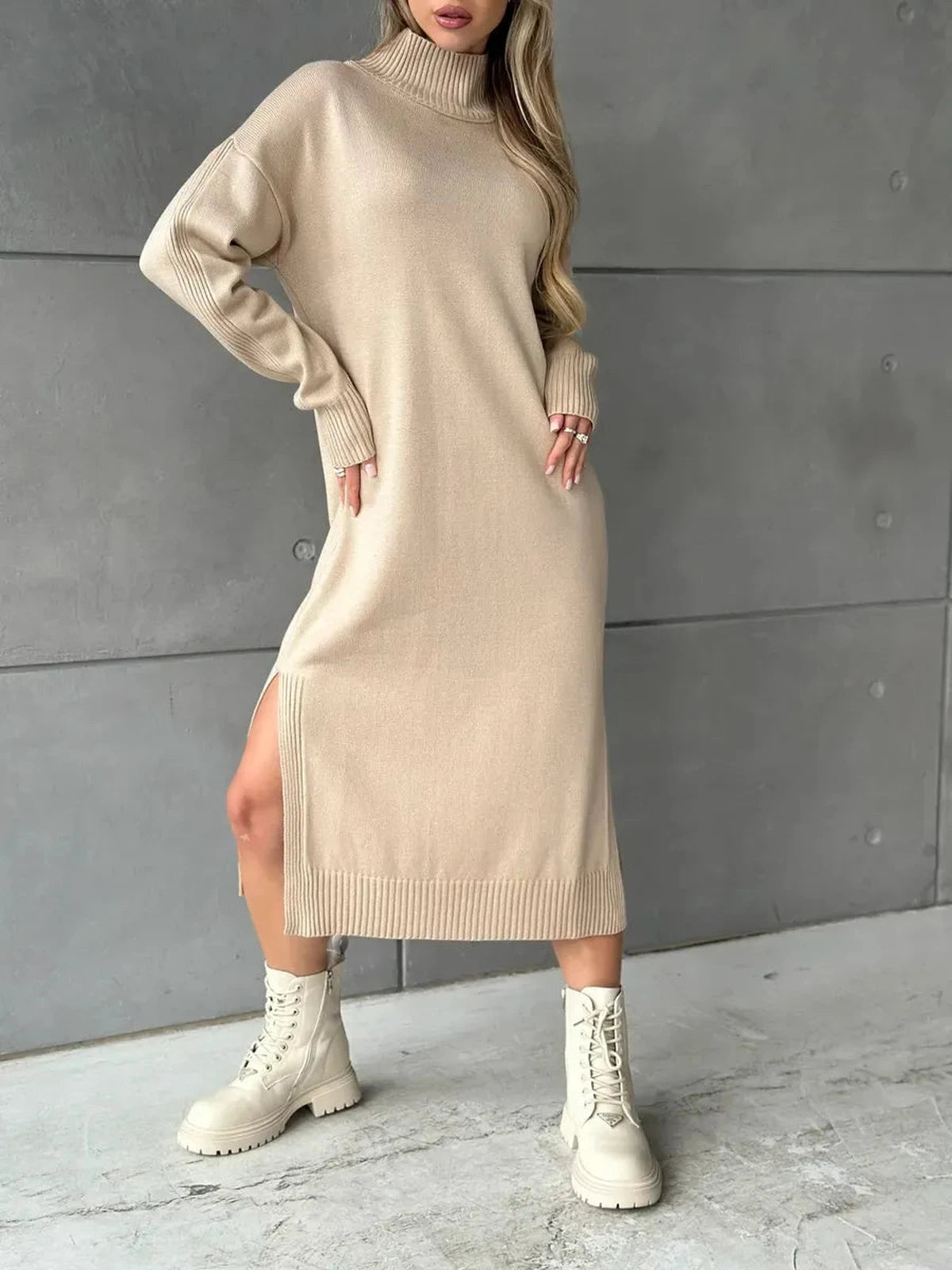 Seren Midi Dress by Lauven showcases a minimalist knit design in classic beige with a high-neck collar and relaxed silhouette.