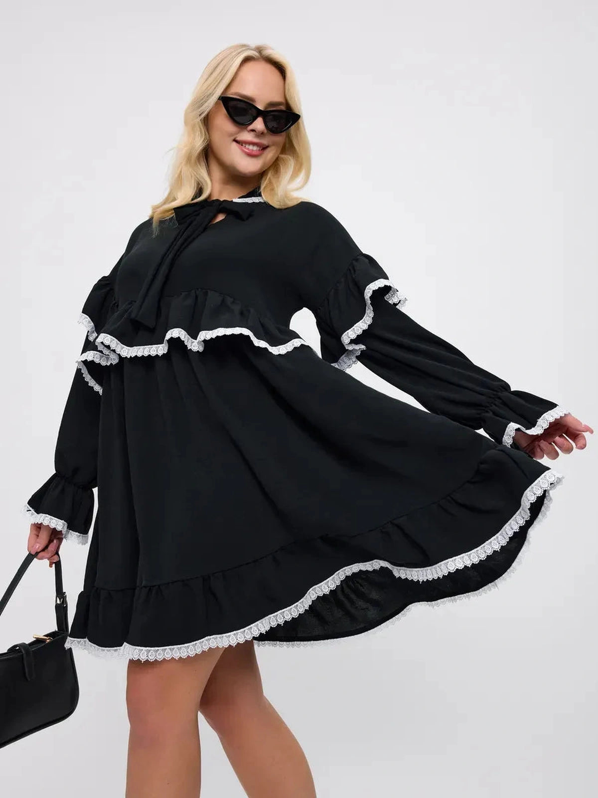 Noiré Mini Dress by Lauven featuring elegant ruffles and delicate lace trim in black.