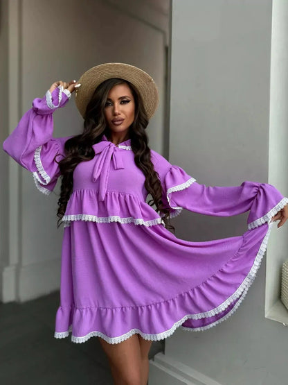 Violetta Mini Dress by Lauven in lilac with ruffles, lace trim, and a flowing silhouette, perfect for elegant styling.