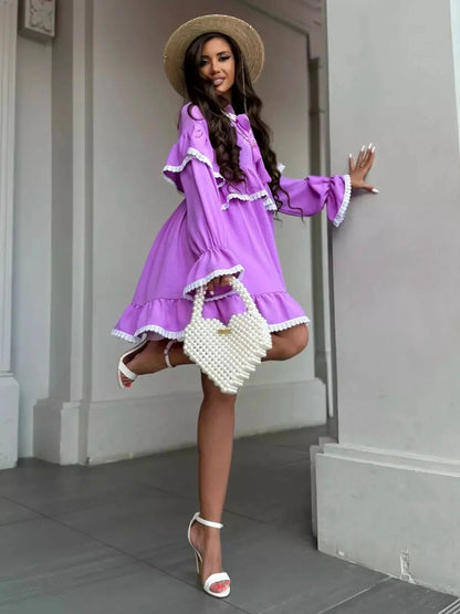 Violetta Mini Dress by Lauven featuring delicate lace, flowing ruffles, and a lilac color for a stylish summer look.