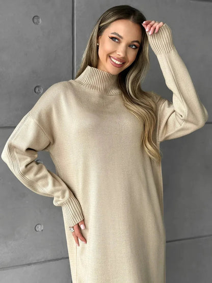 Woman wearing the Seren Midi Dress by Lauven, showcasing its elegant high-neck design and cozy beige knit fabric.