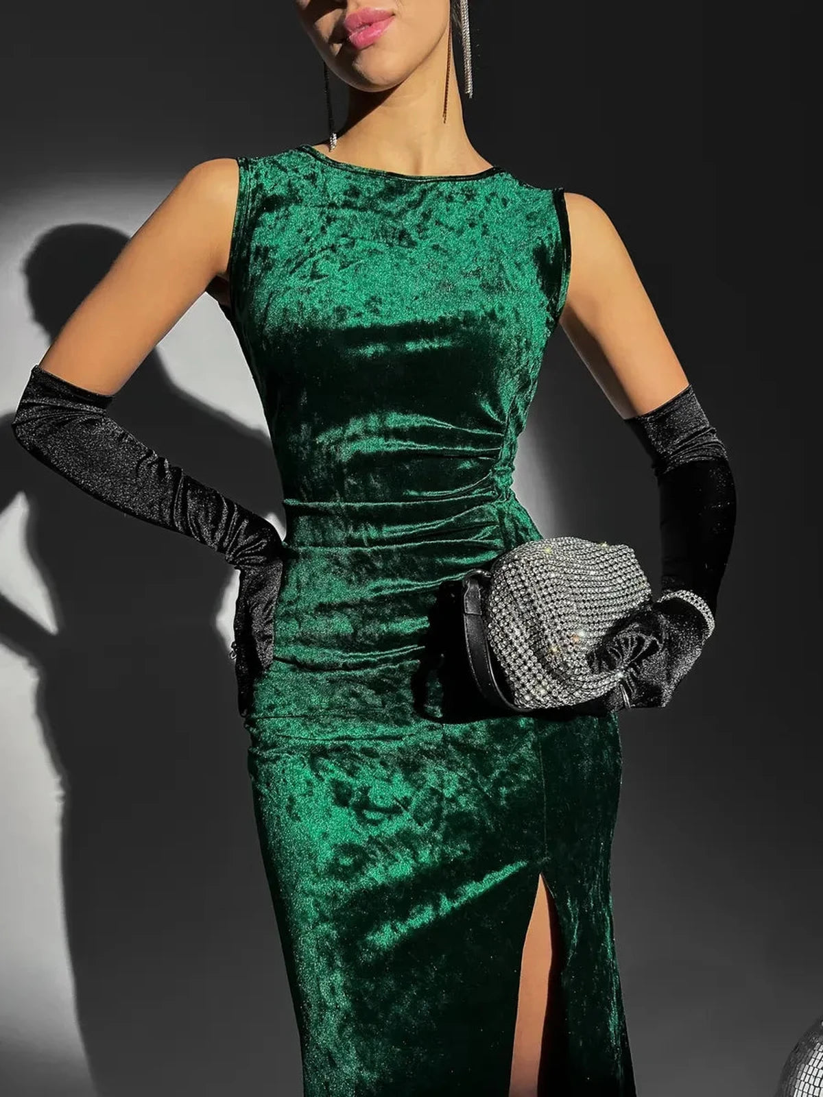 Emeralda Maxi Dress by Lauven, featuring luxurious emerald green velvet, elegant detailing, and a high slit.