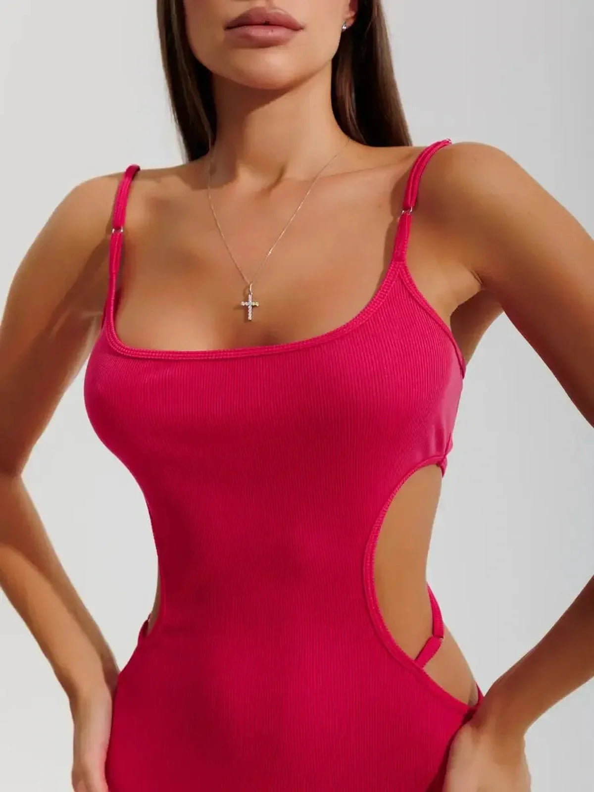 Sculpt Midi Dress in vibrant pink with contour cutouts and ribbed knit fabric, showcasing a figure-hugging silhouette.