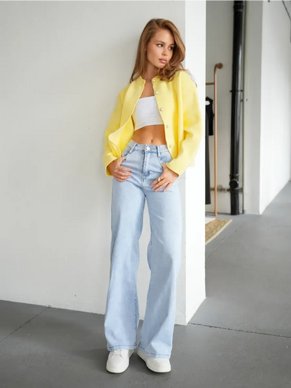 Model wearing Lemonade Cardigan by Lauven, styled with a cropped top and light jeans for a chic casual look.