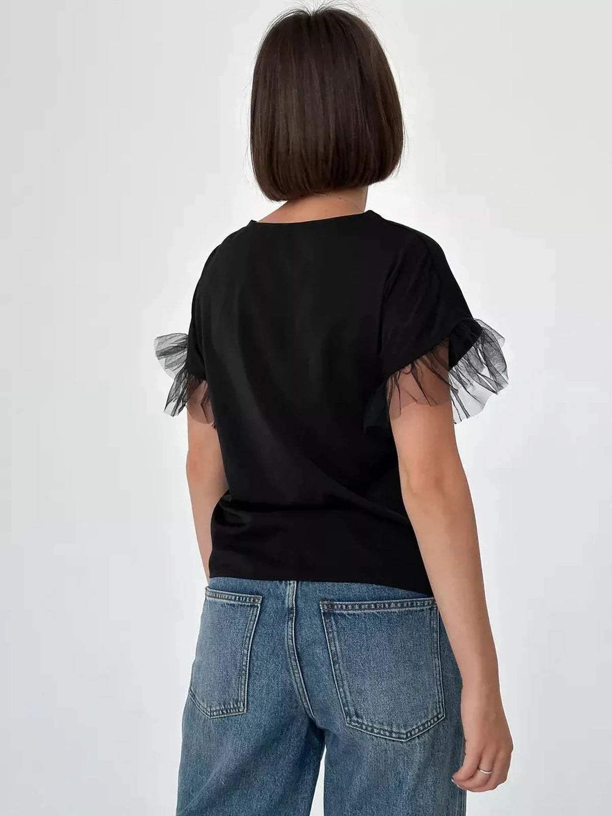 Noiré Blouse by Lauven - Elegant short sleeve black blouse with tulle ruffle detail, showcased from the back.