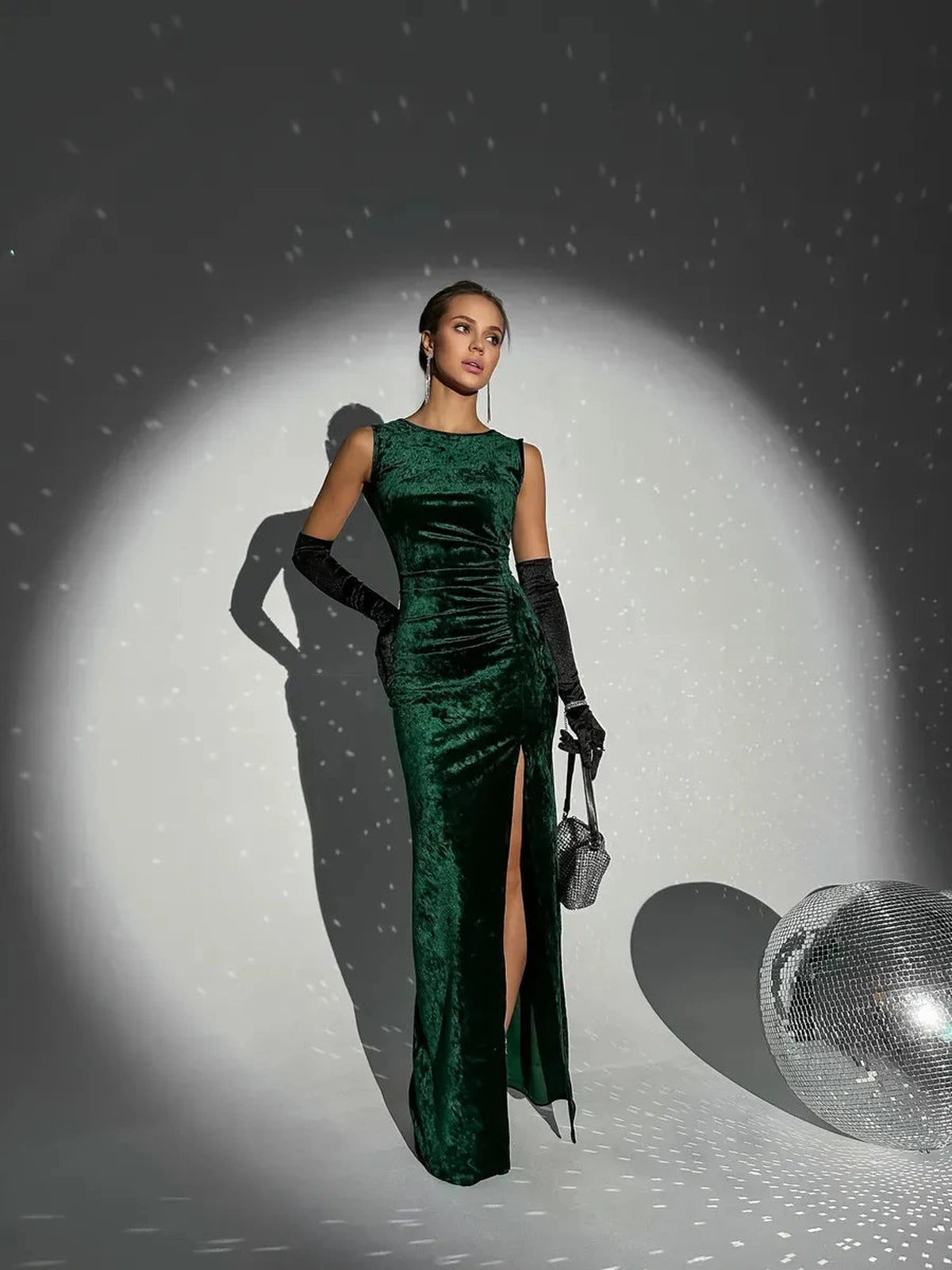 Emeralda Maxi Dress by Lauven featuring rich emerald green velvet and elegant silhouette with a high slit.