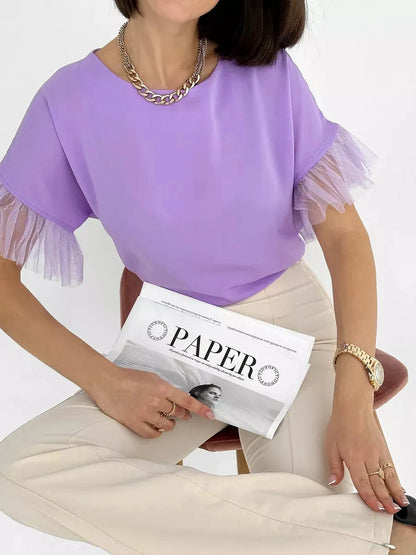 Lavande Blouse by Lauven - Lilac short sleeve blouse with sheer ruffle detail, styled with neutral pants.