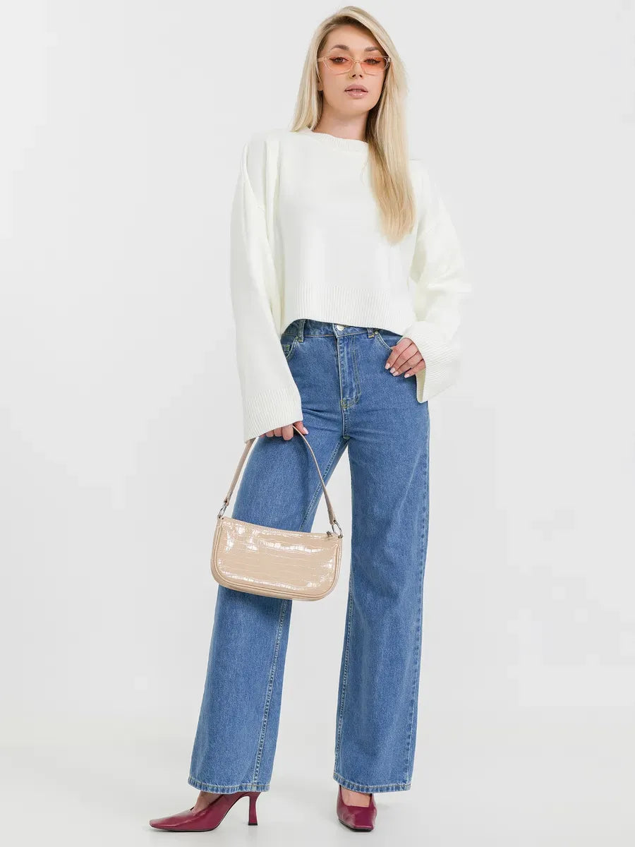 Model wearing the Luna Sweater by Lauven, styled with high-waisted jeans and a chic handbag.