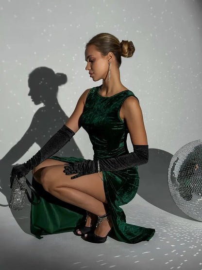 Emeralda Maxi Dress by Lauven in luxurious emerald green velvet, showcasing elegant draping and a high slit.