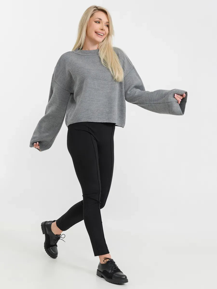 Astra Sweater by Lauven, grey knitwear stylishly worn with black leggings for a casual yet polished look.