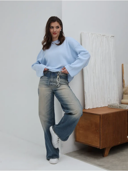 Celine Sweater by Lauven, oversized knit in sky blue, styled with light blue jeans, showcasing casual elegance.