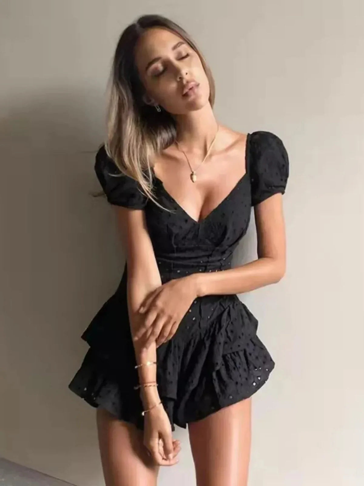 Blackberry corset mini dress featuring puff sleeves and layered ruffles, perfect for parties and special occasions.