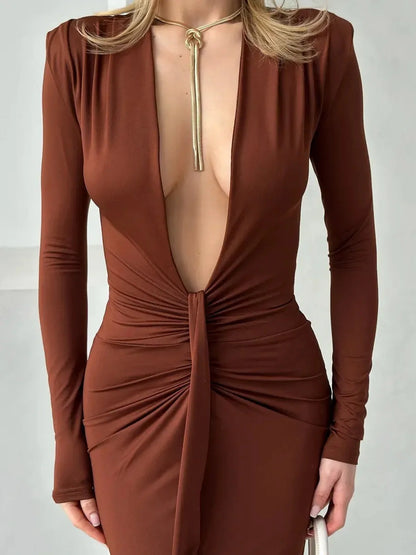 Sienna Plunge Maxi Dress featuring a deep V-neckline and sculpted silhouette in rich brown fabric.