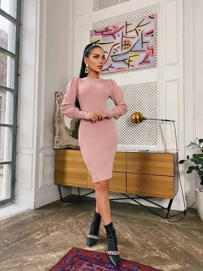 Model wearing Blush Hour sculpted mini dress with puff sleeves and gold-tone button details in an elegant interior.