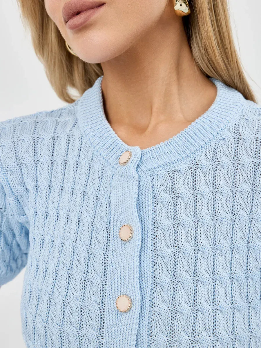 Close-up of the Celeste Cardigan by Lauven featuring breathable knitwear and button closure in soft blue.
