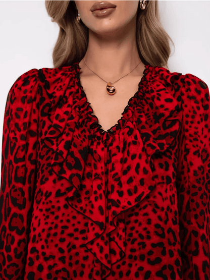 Savanna Mini Dress by Lauven in red leopard chiffon with ruffles, showcasing bold elegance and feminine style.
