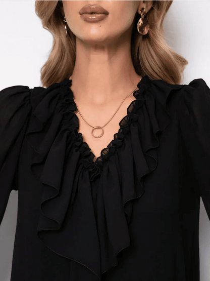 Close-up of ruffled neckline on the Noirelle Mini Dress by Lauven, showcasing elegance and sophistication.