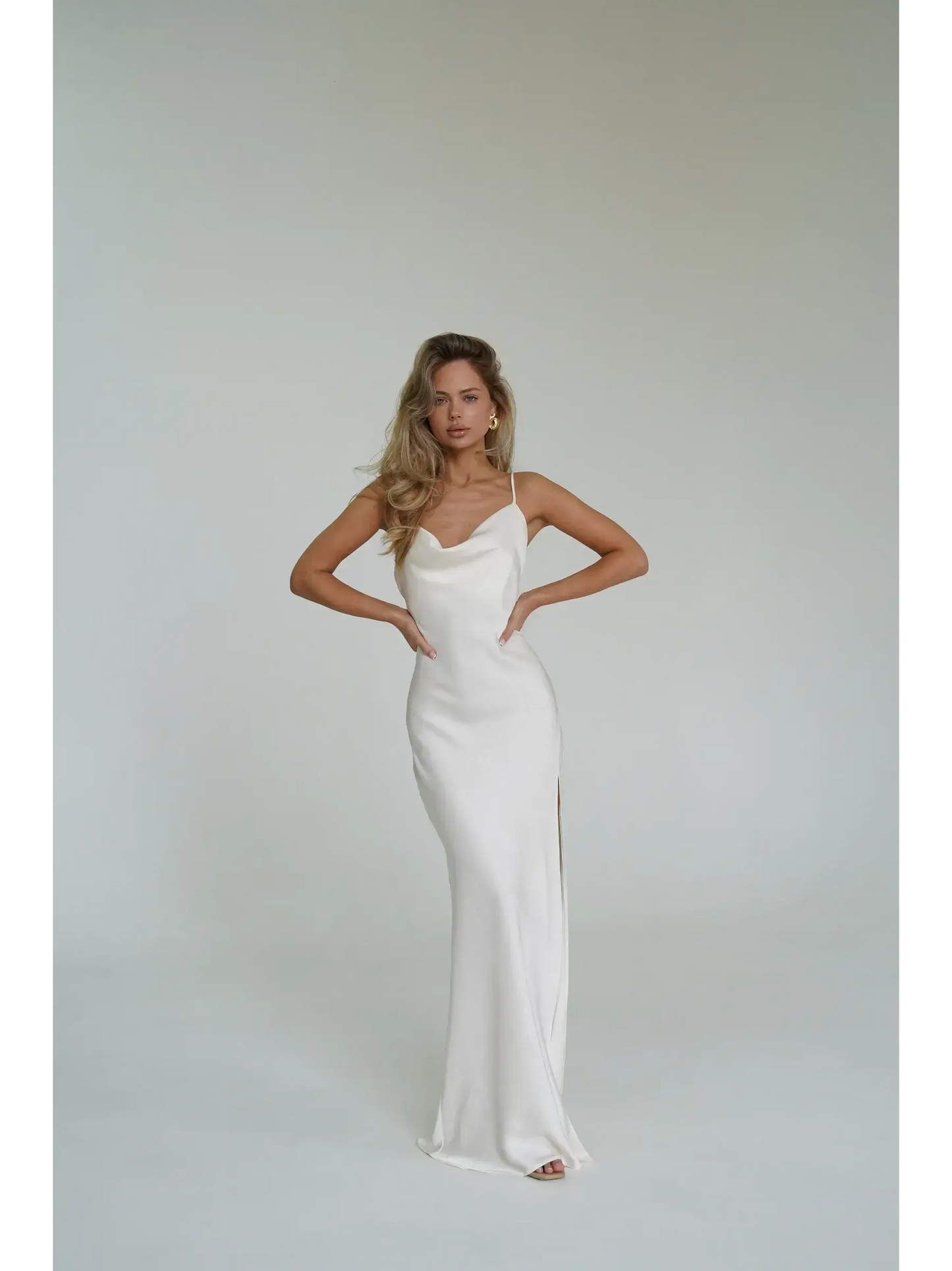 Ivory Luxe Maxi Dress featuring a silky drape, cowl neckline, and side slit, perfect for summer elegance.