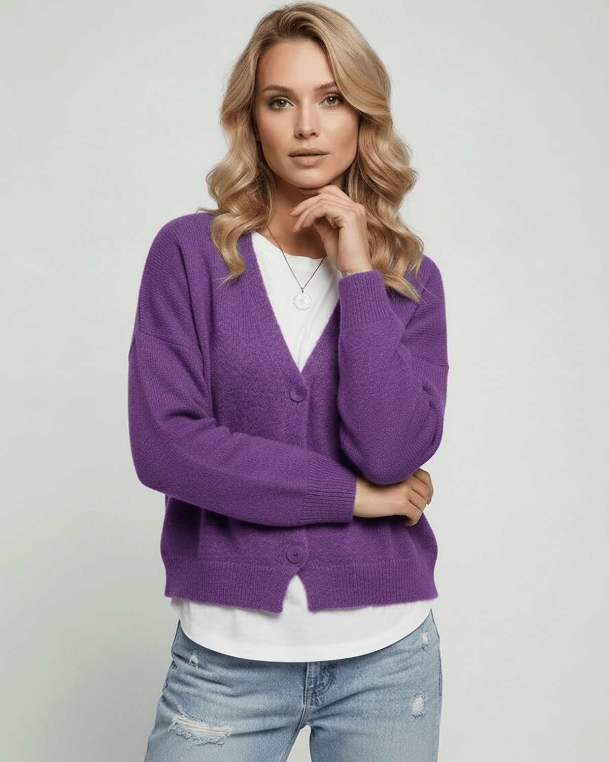 Iris Cardigan by Lauven on a model, vibrant purple cozy knitwear, classic V-neck design.