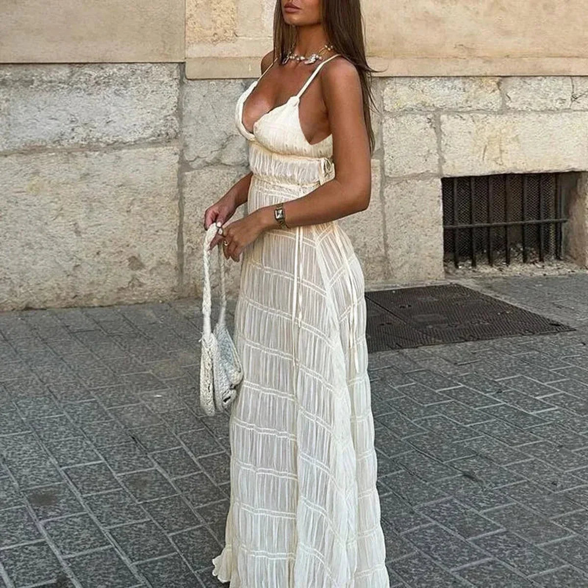 Elegant white maxi dress with delicate shirring, perfect for weddings, summer events, and formal occasions.