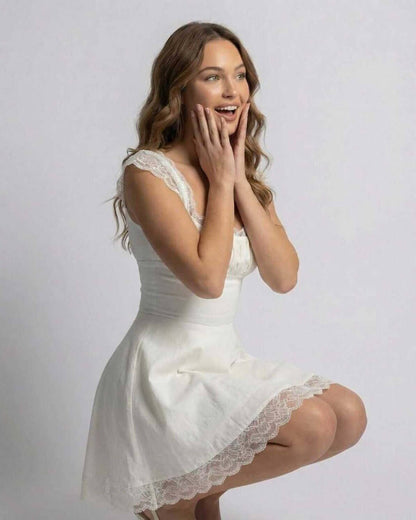 Isla Mini Dress by Lauven, featuring lace details and a flattering slim fit in pristine white.