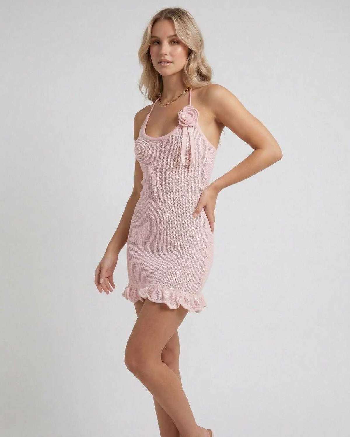 Isla Mini Dress by Lauven, pink halter neck pleated mini dress with spaghetti straps and ruffled hem.