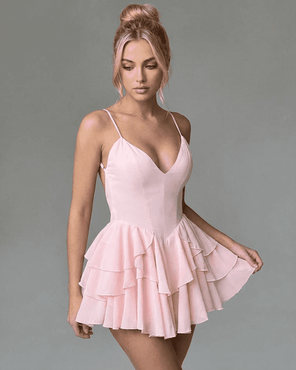 Isolde Mini Dress by Lauven, featuring a V-neck, spaghetti straps, and layered ruffle skirt in a playful pink hue.