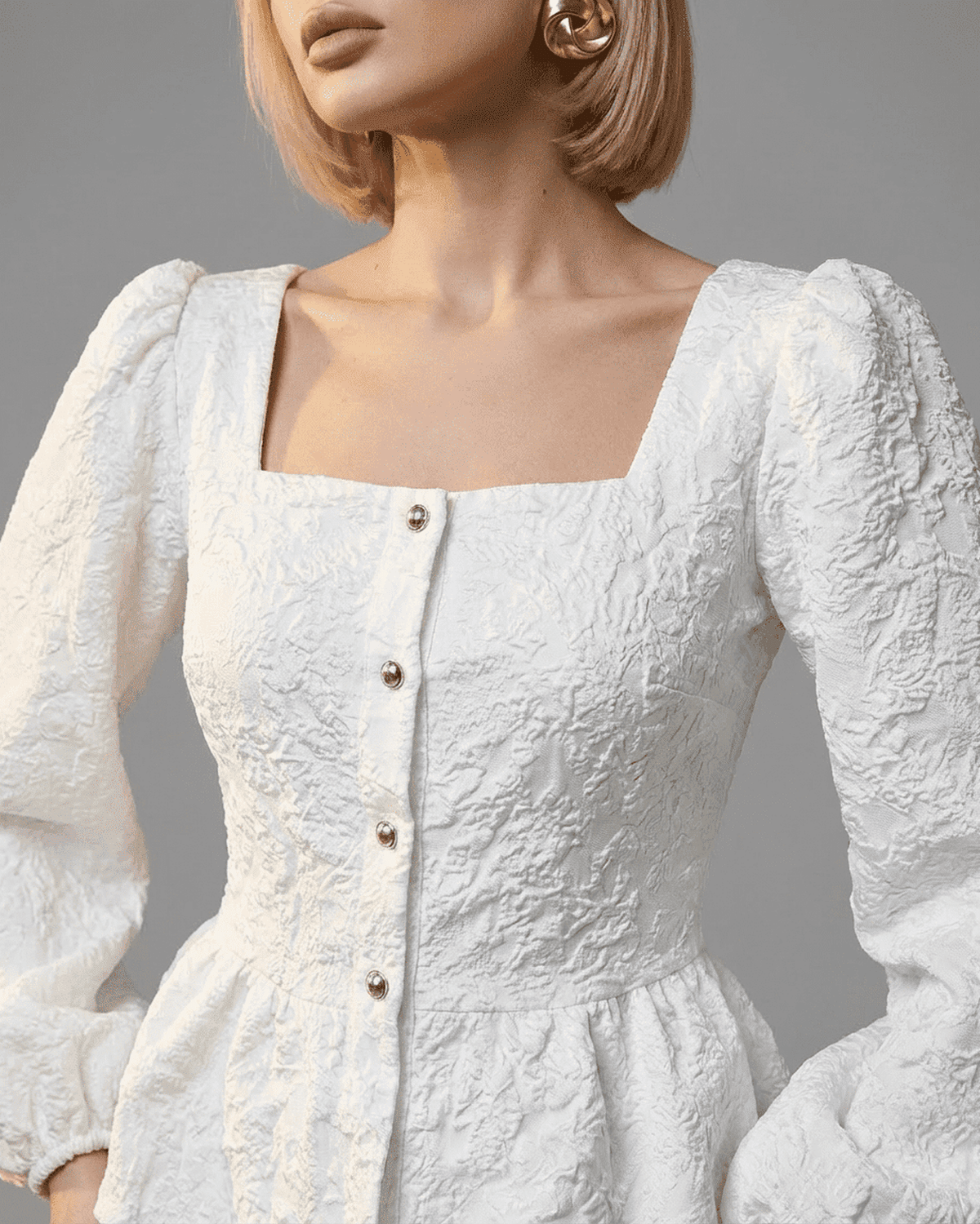 Ivory Corset Top by Lauven featuring square neckline, puff sleeves, and structured jacquard fabric in white.