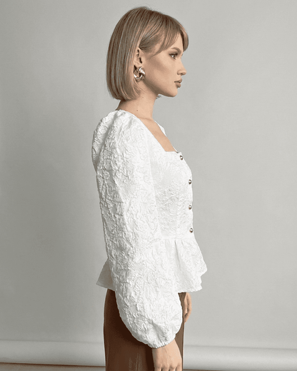 Ivory Corset Top by Lauven, featuring jacquard fabric and puff sleeves, showcasing a refined and elegant look.