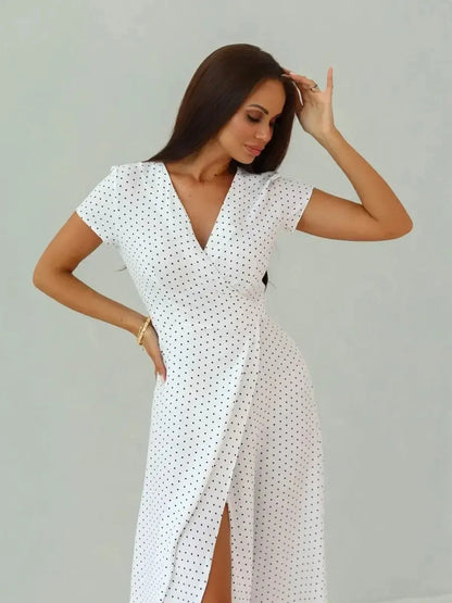 Ivory Dots Maxi Dress with wrap silhouette and high slit, featuring white base and black polka dots, perfect for summer style.