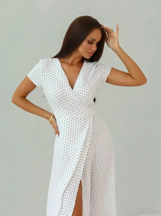 Ivory Dots Maxi Dress with wrap silhouette and high slit, featuring white base and black polka dots, perfect for summer style.