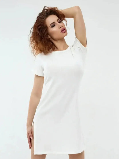Ivory Glow mini dress by Lauven in white, showcasing a sleek silhouette and modern side slits, perfect for warm weather.