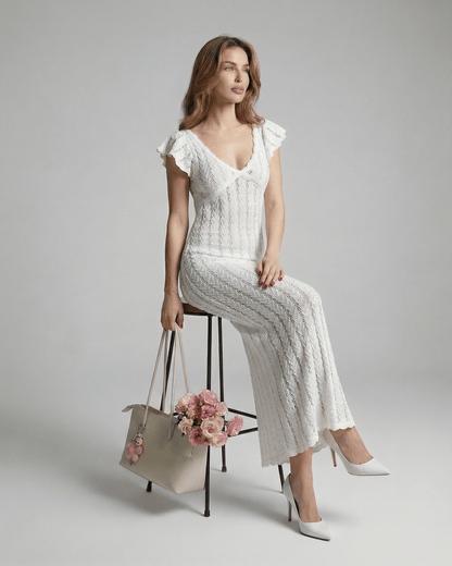 Ivory Lace Maxi by Lauven, featuring a V-neck bodycon design with ruffle sleeves and floral handbag.