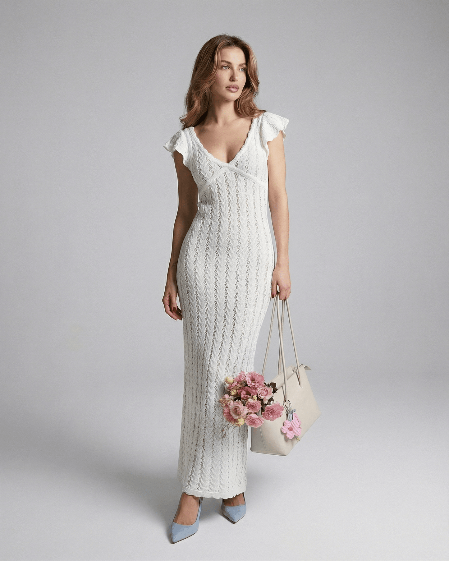 Ivory Lace Maxi dress by Lauven, featuring a V-neckline, ruffle sleeves, and intricate lace detailing.