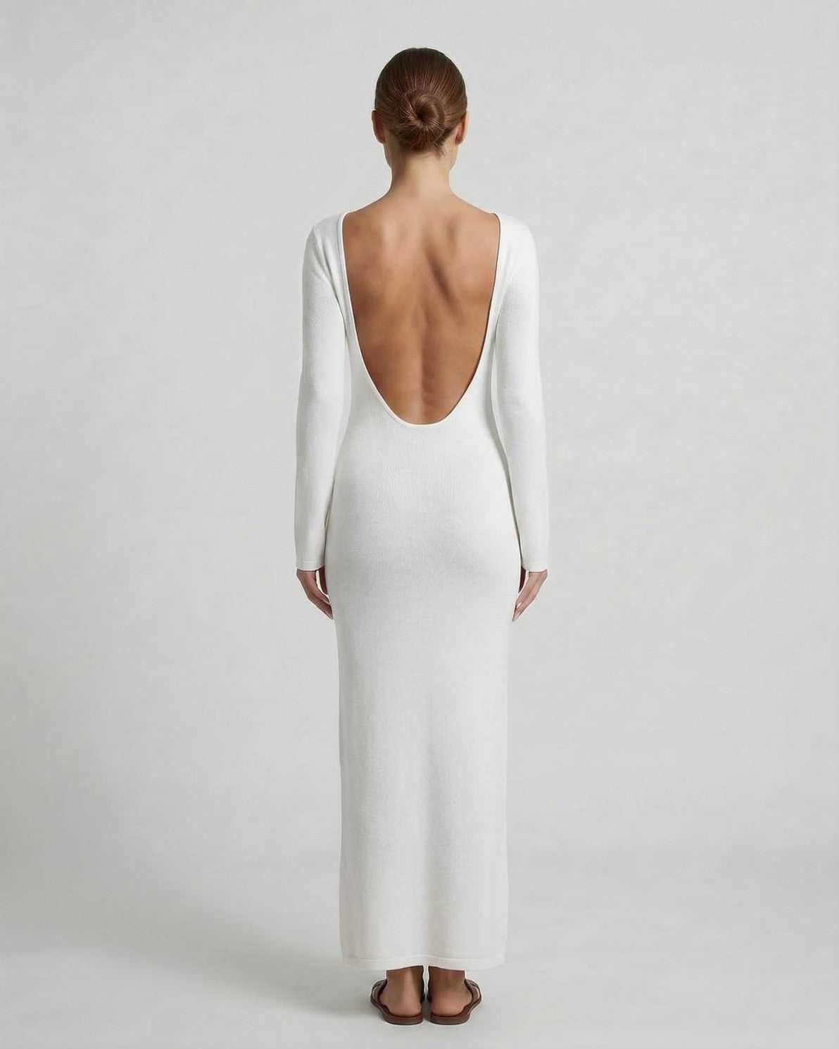 Elegant back view of Ivory Maxi Dress by Lauven showcasing a sleek design and deep V-neckline.
