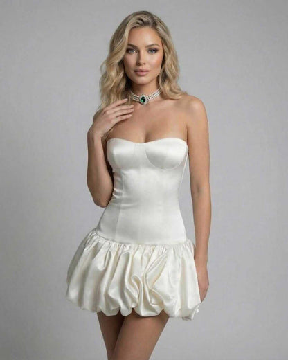 Ivory Mini Dress from Lauven – Strapless bodycon design with ruffled hemline.