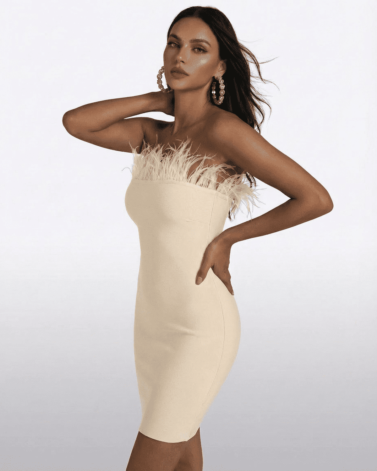 Ivory Mini Dress by Lauven - Strapless feather-trimmed bodycon design showcasing elegant silhouette.
