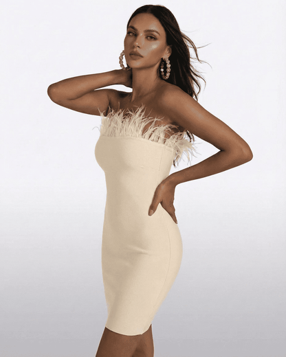 Ivory Mini Dress by Lauven - Strapless feather-trimmed bodycon design showcasing elegant silhouette.