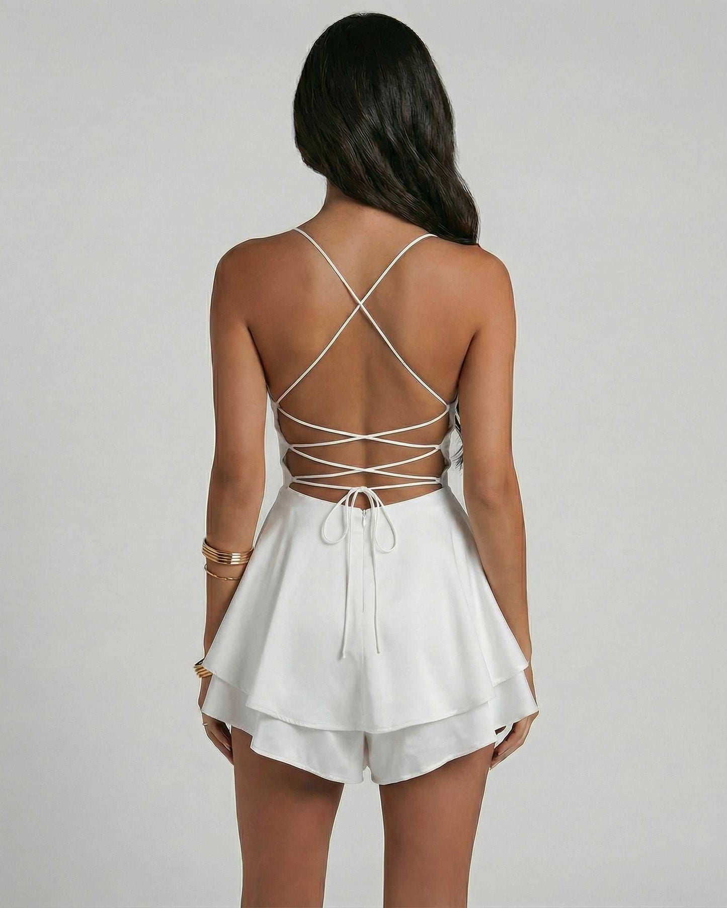 Ivory Mini Dress by Lauven showcasing a stylish back view with delicate crisscross straps and layered detailing.